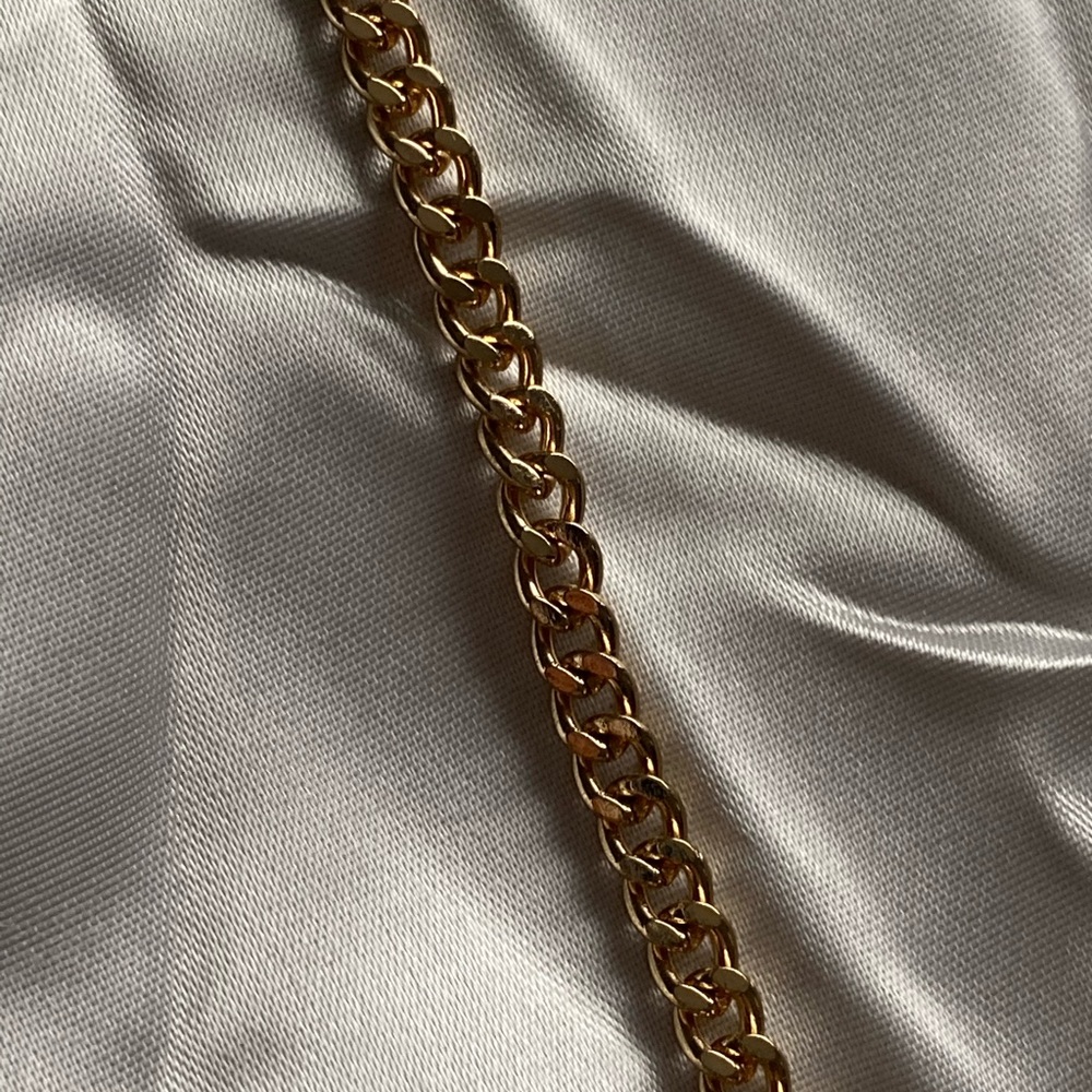 Small link gold chain.